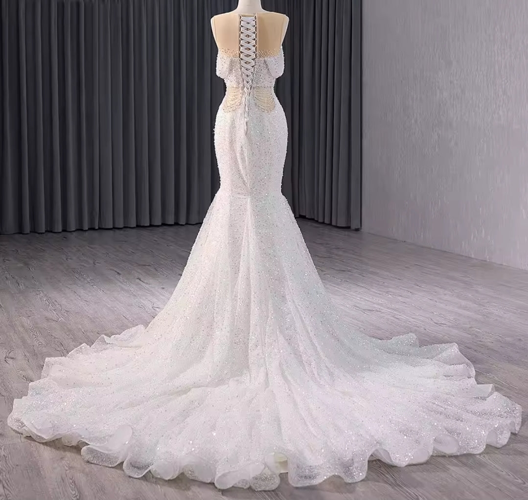 Elegant Sleeveless Crystal Beaded Illusion Boat Neck Bridal & Ceremonial Gown With Draped Beading And Cutout Center Detail