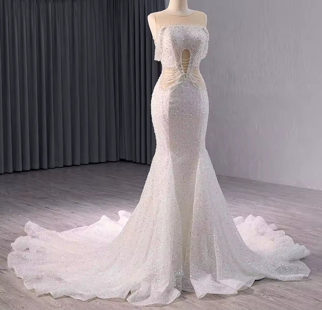 Elegant Sleeveless Crystal Beaded Illusion Boat Neck Bridal & Ceremonial Gown With Draped Beading And Cutout Center Detail