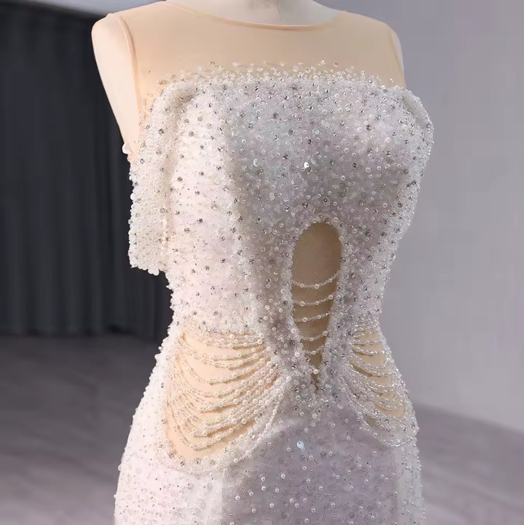 Elegant Sleeveless Crystal Beaded Illusion Boat Neck Bridal & Ceremonial Gown With Draped Beading And Cutout Center Detail