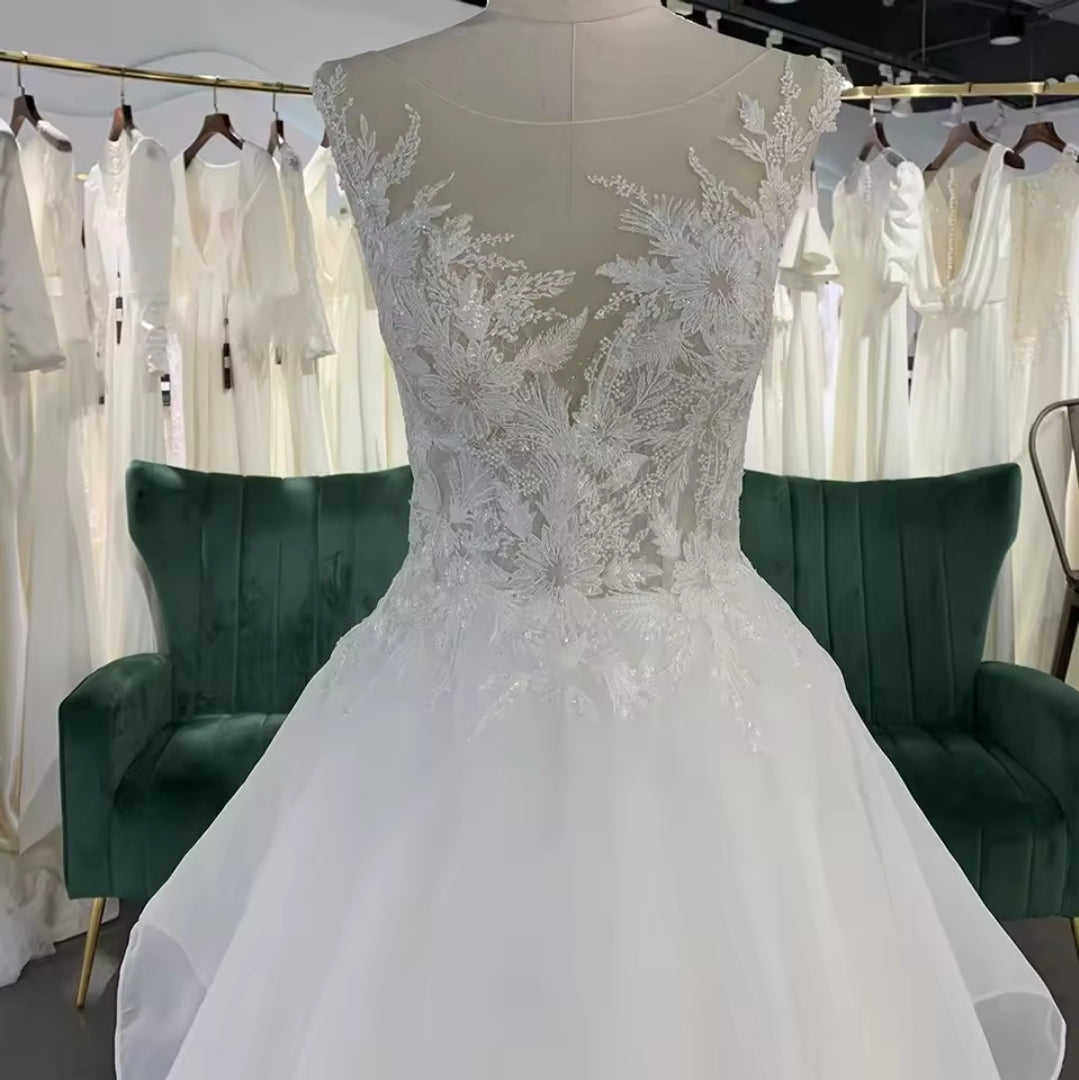 Sleeveless Floral Illusion V Neck Layered Flowing Elegant A-Line Bridal And Ceremonial Gown