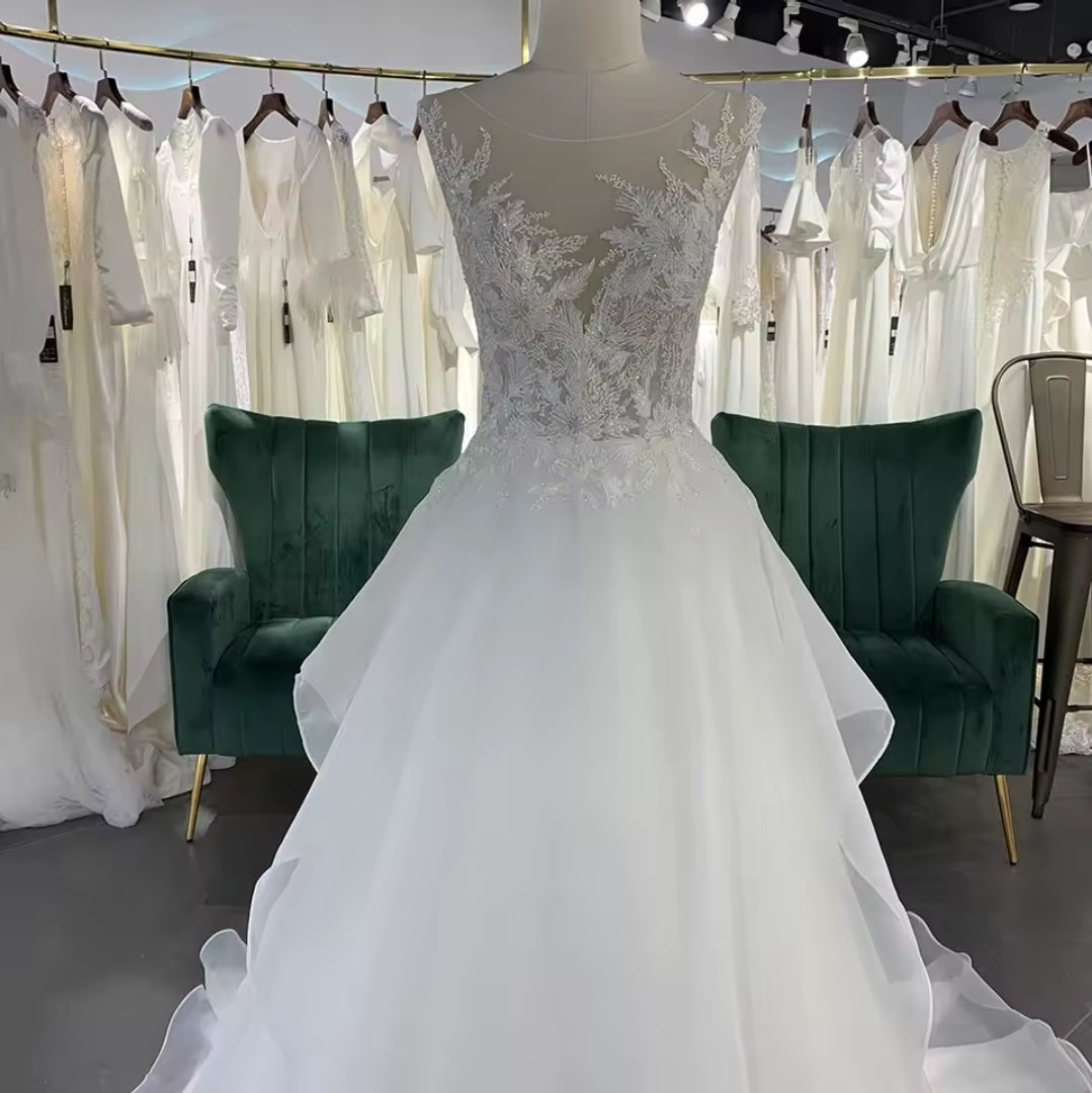 Sleeveless Floral Illusion V Neck Layered Flowing Elegant A-Line Bridal And Ceremonial Gown