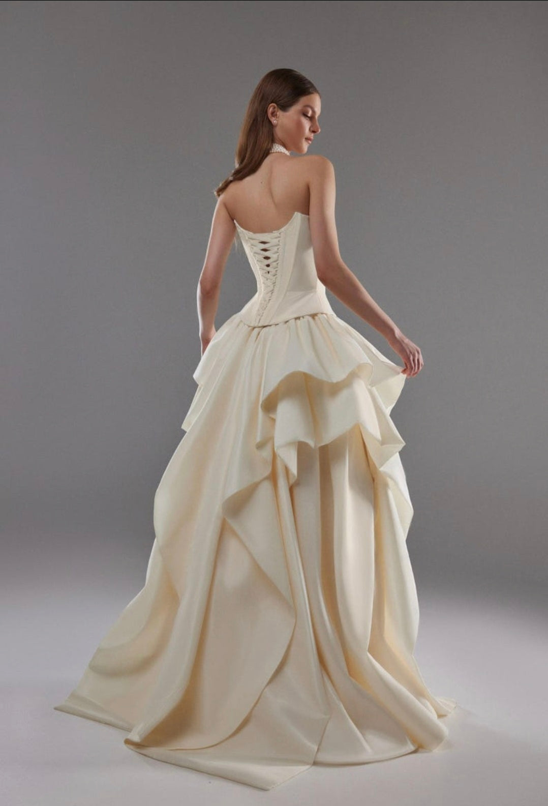 Cat Eye Boat Neck Strapless Front Multi Button Detail Corset Bridal And Ceremonial Gown With Multi Layered Skirt And Split Hem
