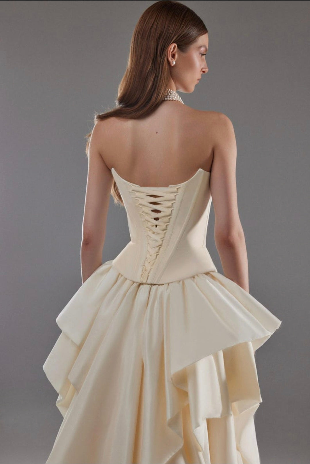 Cat Eye Boat Neck Strapless Front Multi Button Detail Corset Bridal And Ceremonial Gown With Multi Layered Skirt And Split Hem