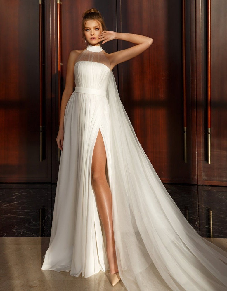 Sleeveless Pleated Broad Halter Neck Minimalist Sheath Gown With Thigh High Split Hem