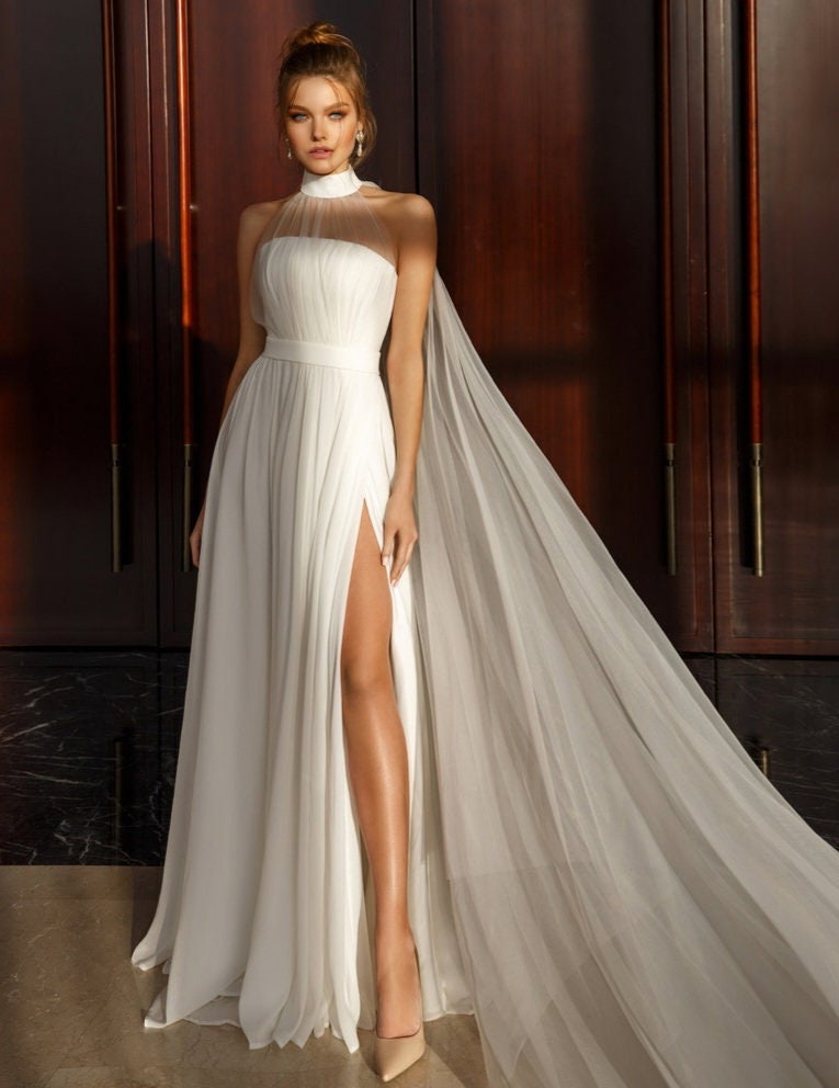 Sleeveless Pleated Broad Halter Neck Minimalist Sheath Gown With Thigh High Split Hem
