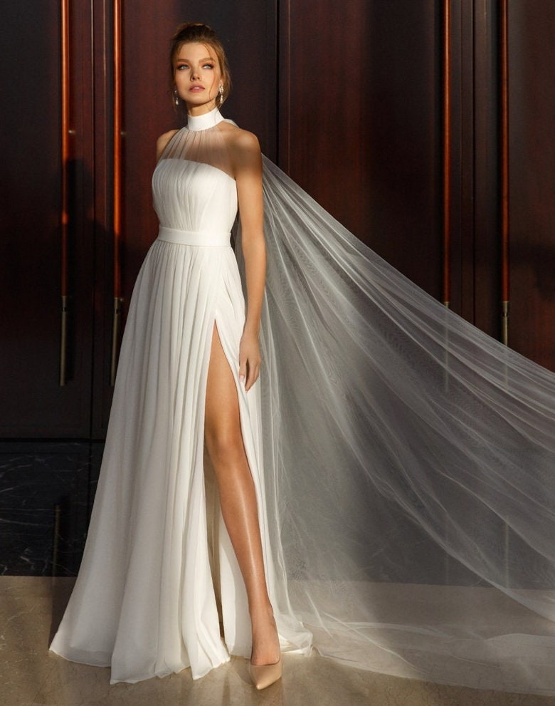 Sleeveless Pleated Broad Halter Neck Minimalist Sheath Gown With Thigh High Split Hem