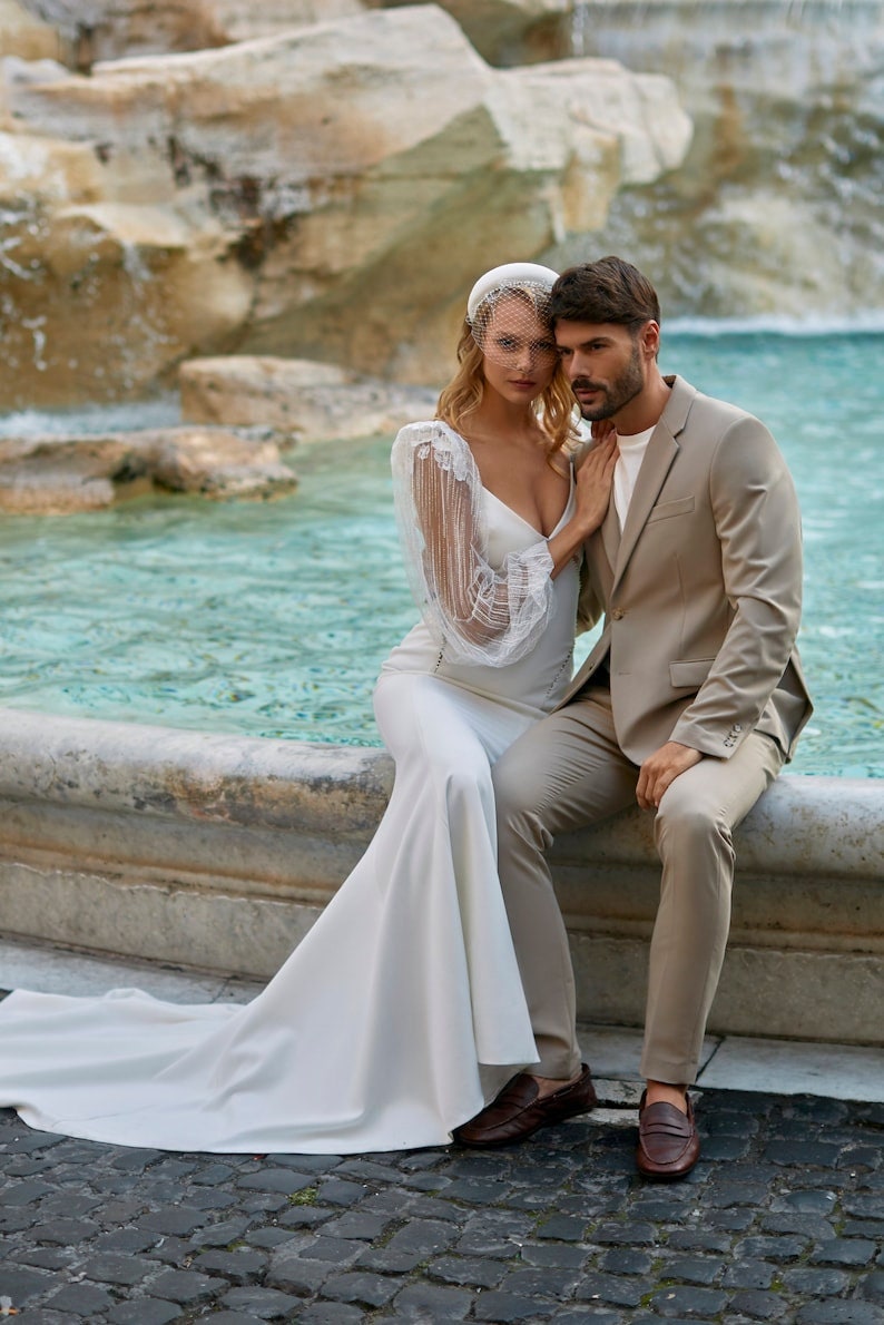 Sheer Shimmering Floral Shoulder Detail Long Sleeve Cutout Side Shimmering And Open Back Trumpet Bridal Gown