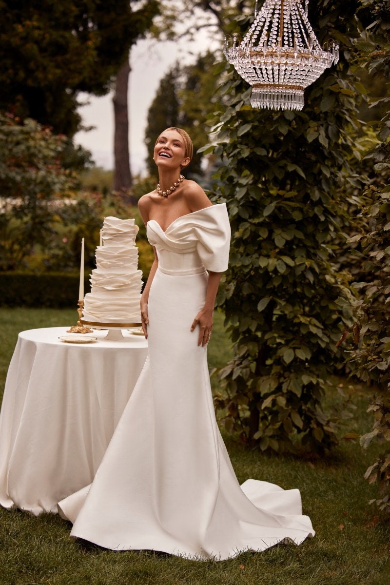 one shoulder trumpet wedding dress Trumpet Wedding Dress with One-Shoulder Strap, Lace Sleeves, and Flowing Train| Marelli Exclusive 0 / As pictured