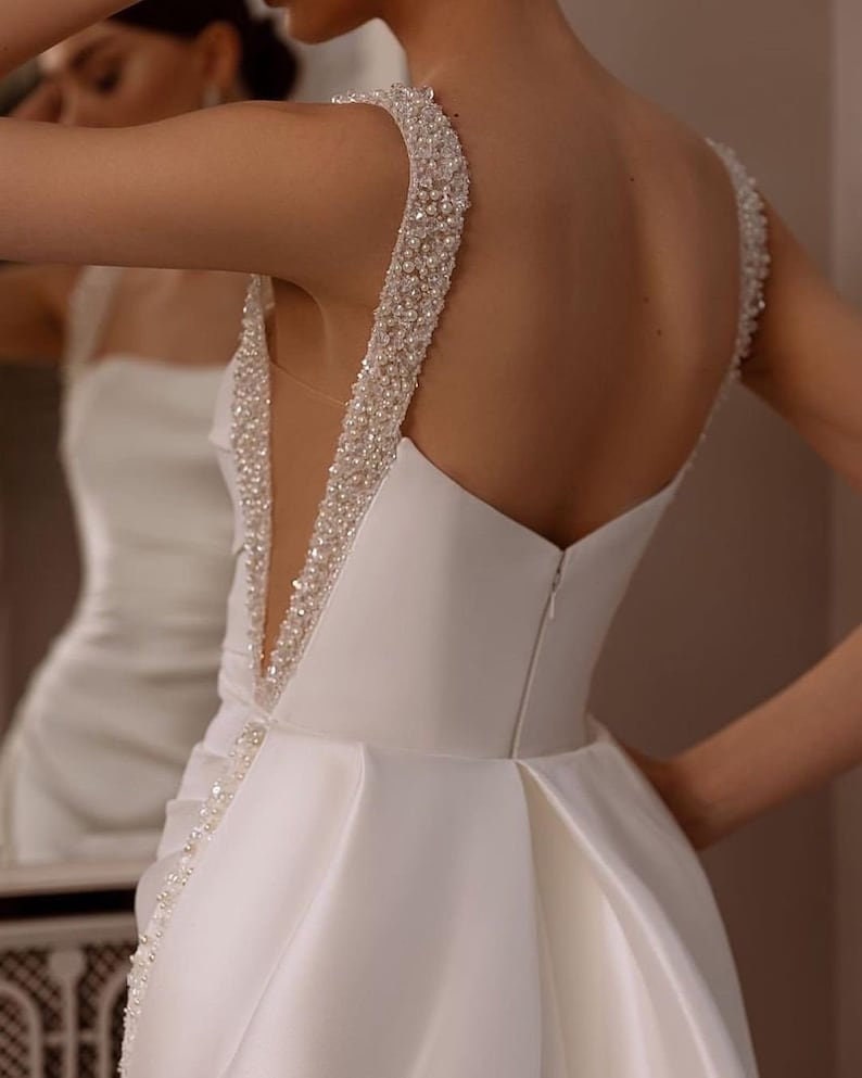 Sleeveless Multi Crystal Beaded Square Neck Satin Minimalist Gown With Detachable Sequin Appliqué Detail Train