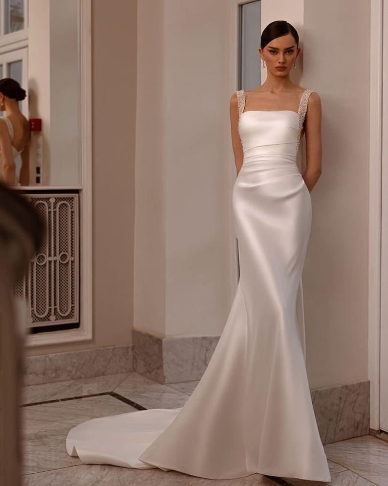 Sleeveless Multi Crystal Beaded Square Neck Satin Minimalist Gown With Detachable Sequin Appliqué Detail Train