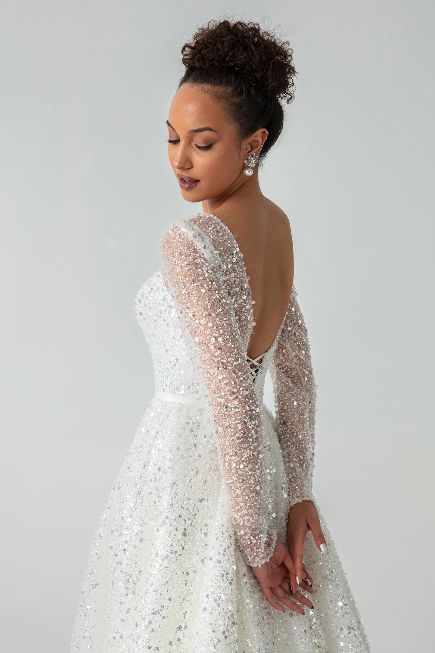 Sparkling Sheer Long Sleeve Sequin Covered Sweetheart A-Line Gown With Open V Back, Bow Knot Sash And Lace Up Enclosure
