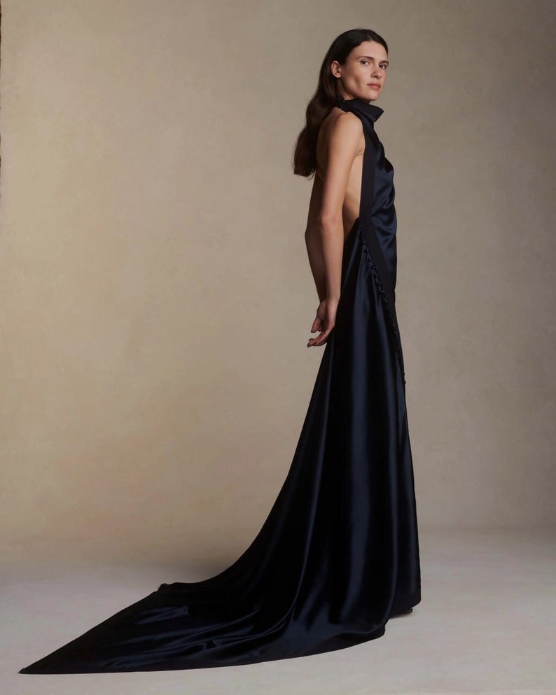 Whimsical Simple & Satin Halter Neck Gown With Side Split Hem With Trailing Buttons