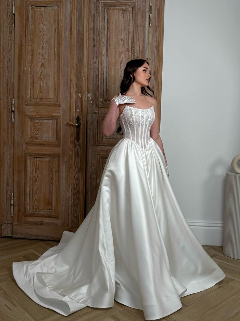 scoop neck corset wedding dress Corset A Line Wedding Dress With Subtle Sparkle Sequin Embroidery Lace, Scoop Neck, Detachable Long Sleeve, Low Back for Modern Bride | JUNO