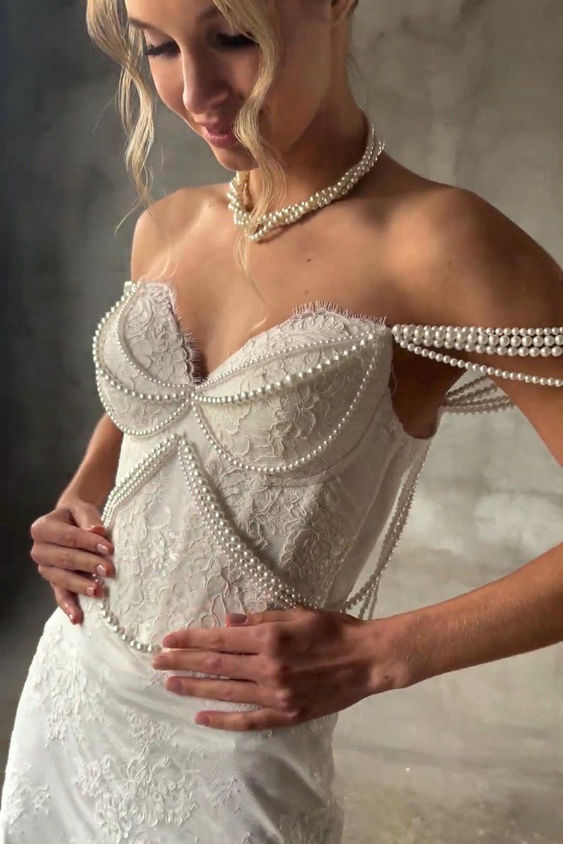Pearl Beaded Spaghetti Strap Off The Shoulder Sweetheart Scattered Floral Lace Trumpet Bridal Gown With Draping Pearl Beading Detail