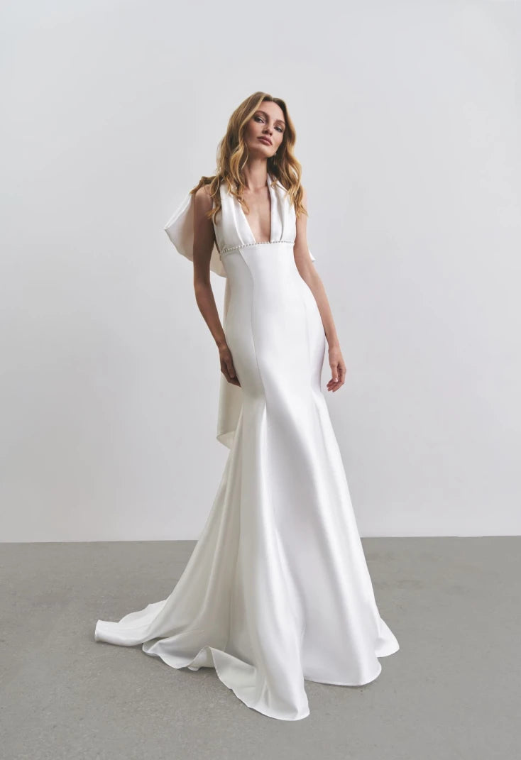 Sophisticated Mikado Fitted Bridal Gown With Pleated Sexy V-Neckline With Wide Straps, Decorated Small Pearl Beaded Bodice And Lush Back Big Bow Detail