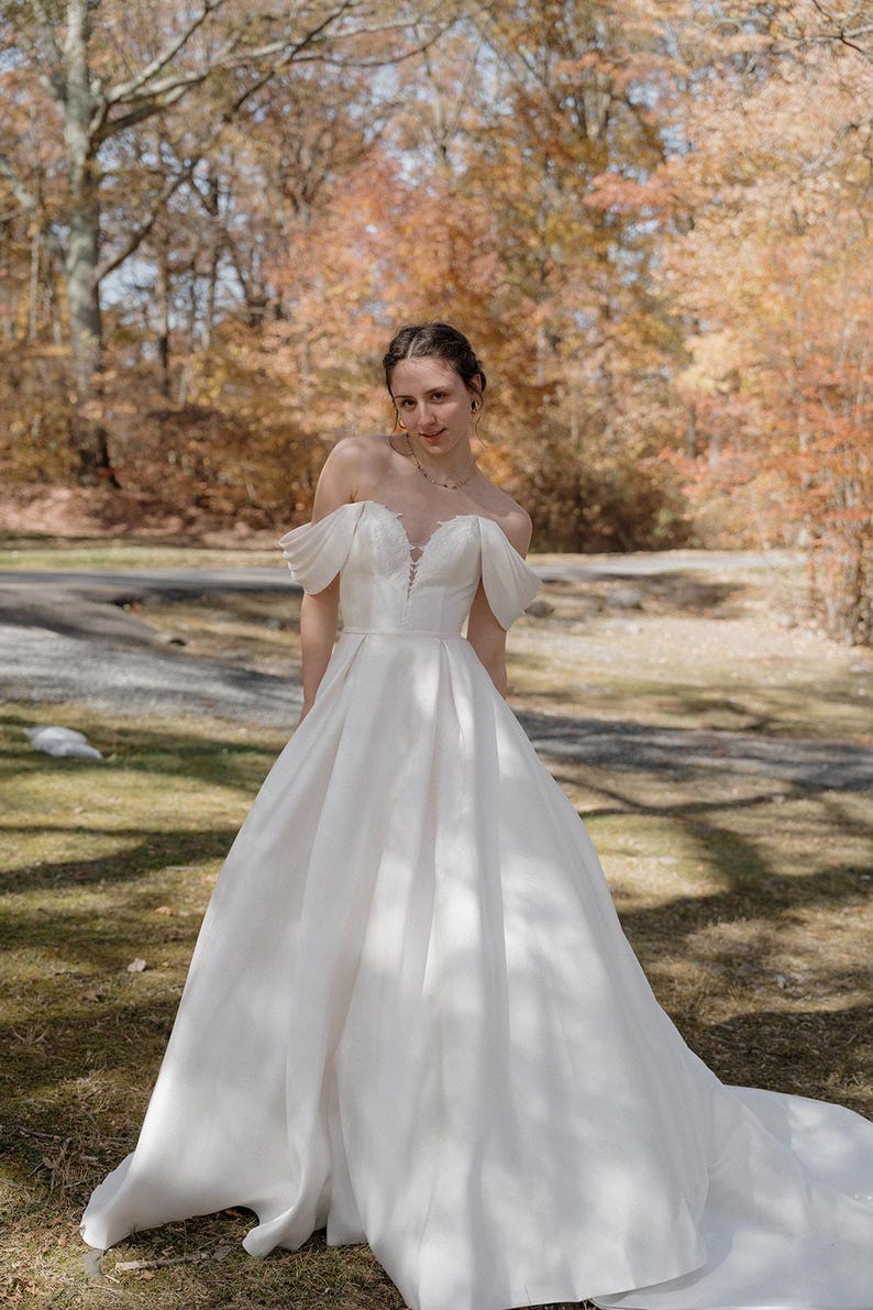Pleated Off The Shoulder Plunging Sweetheart Floral Appliqué Minimalist A-Line Bridal Gown
