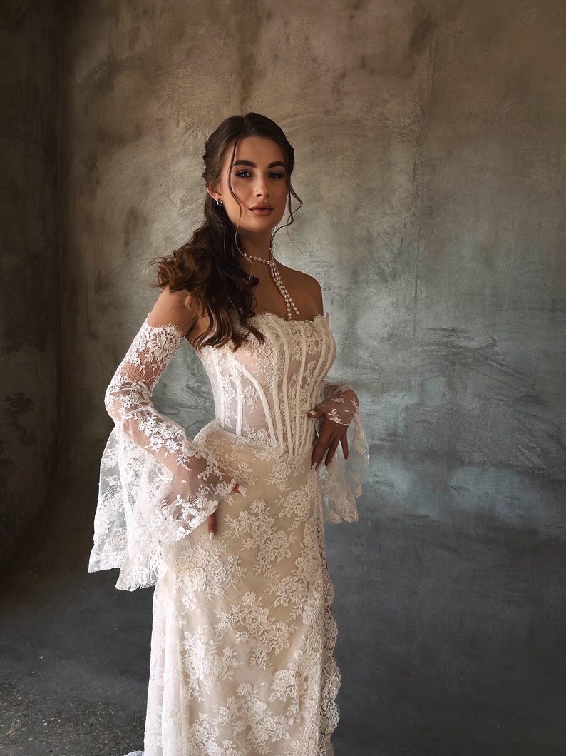 Breathtaking Scattered Floral Lace Corset Inspired Boho Themed Trumpet Bridal Gown With Matching Detached Flare Sleeves