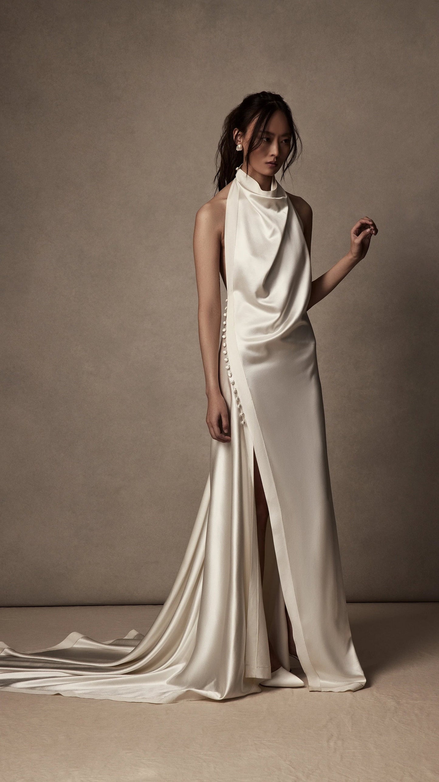 Whimsical Simple & Satin Halter Neck Gown With Side Split Hem With Trailing Buttons