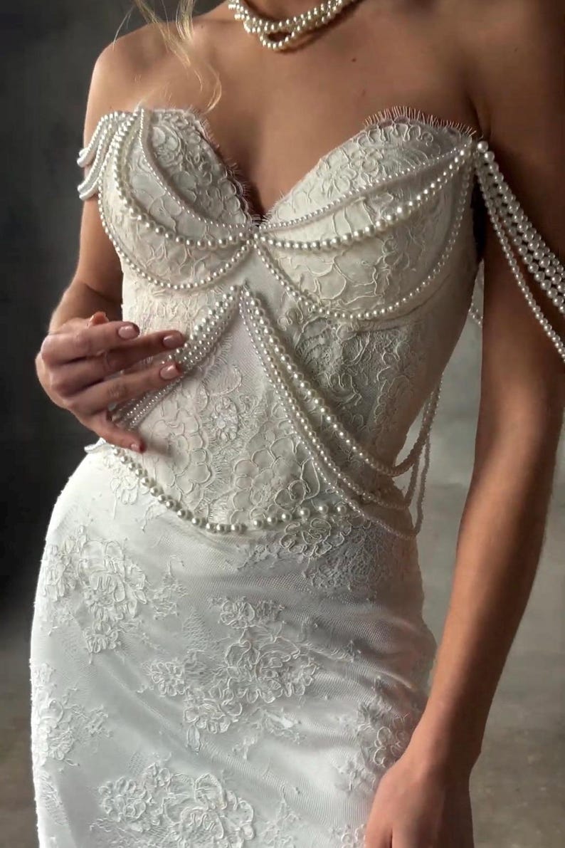 Pearl Beaded Spaghetti Strap Off The Shoulder Sweetheart Scattered Floral Lace Trumpet Bridal Gown With Draping Pearl Beading Detail