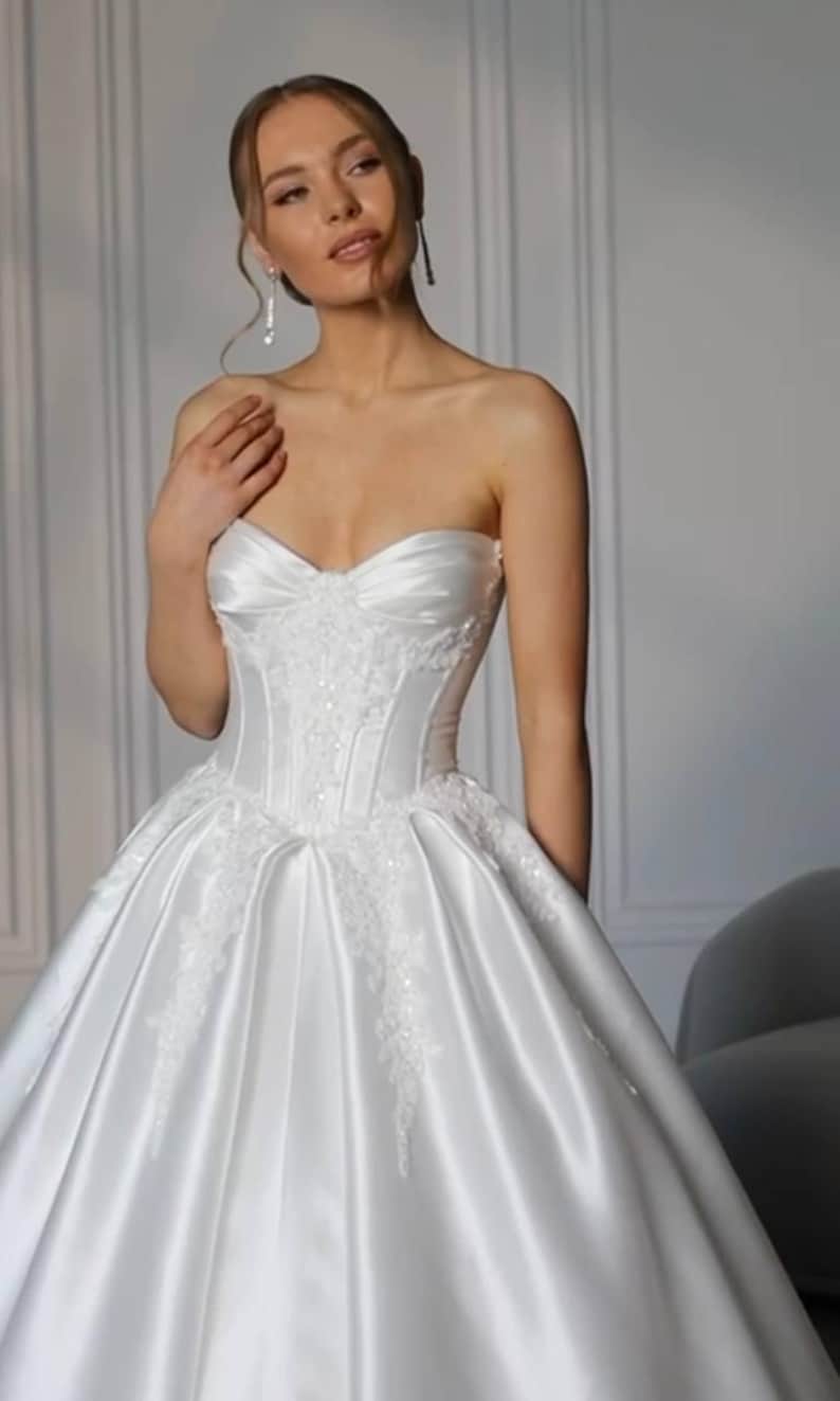 Elegant Mikado Satin Sweetheart Sequinned Floral Appliqué Pleated Corset A-Line Bridal Ball Gown