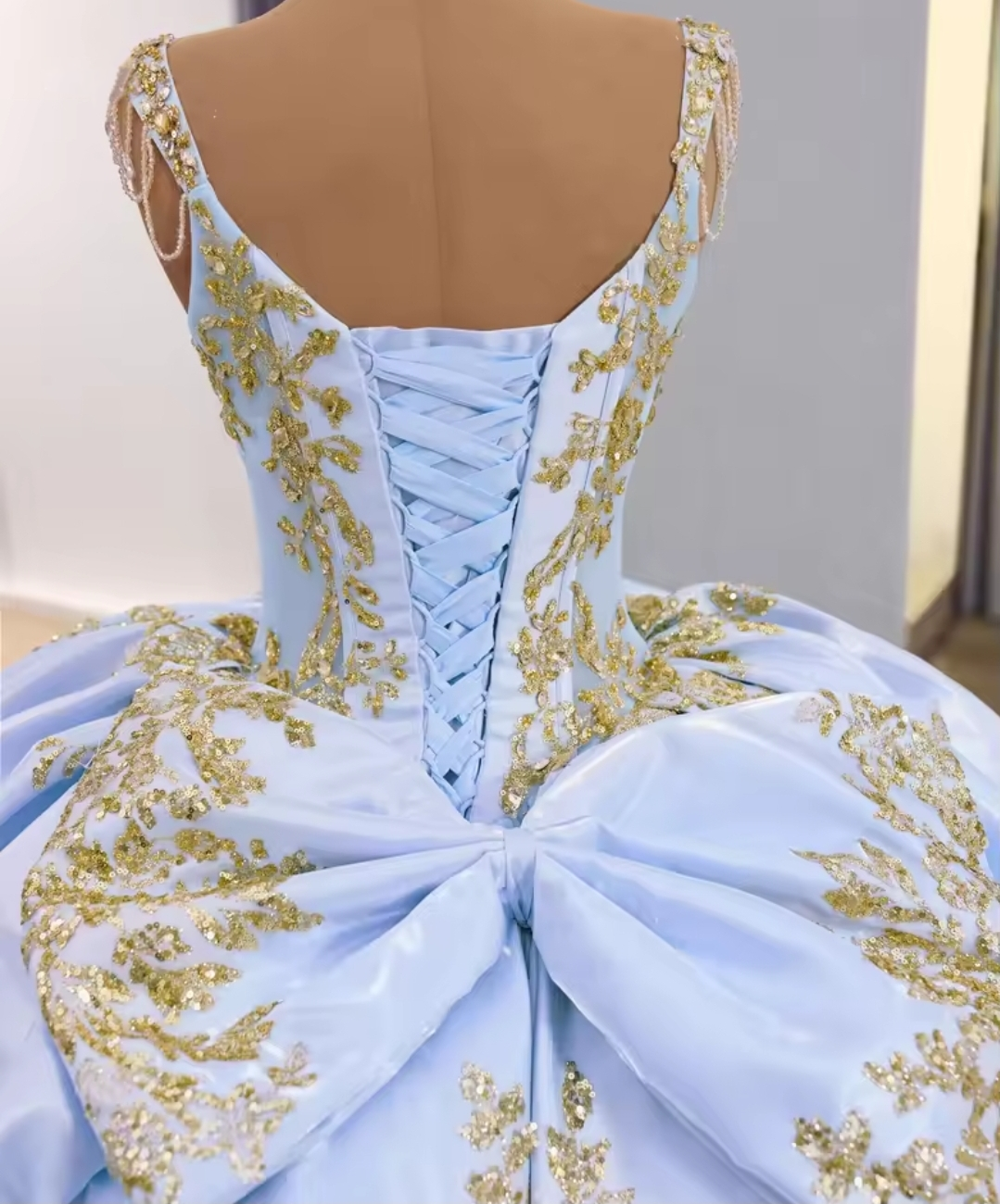 Multi Crystal Beaded Cap Sleeve Blue V Neck Corset A-Line Gone With 3D Floral Motiffs, Scattered Gold Appliqués And Oversized Back Bow Detail