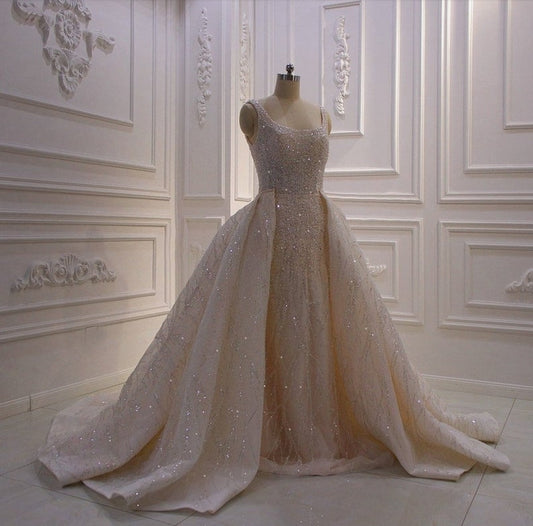 Beautiful Champagne Square Neck Sleeveless Shimmering Sheath Gown With Detachable Train