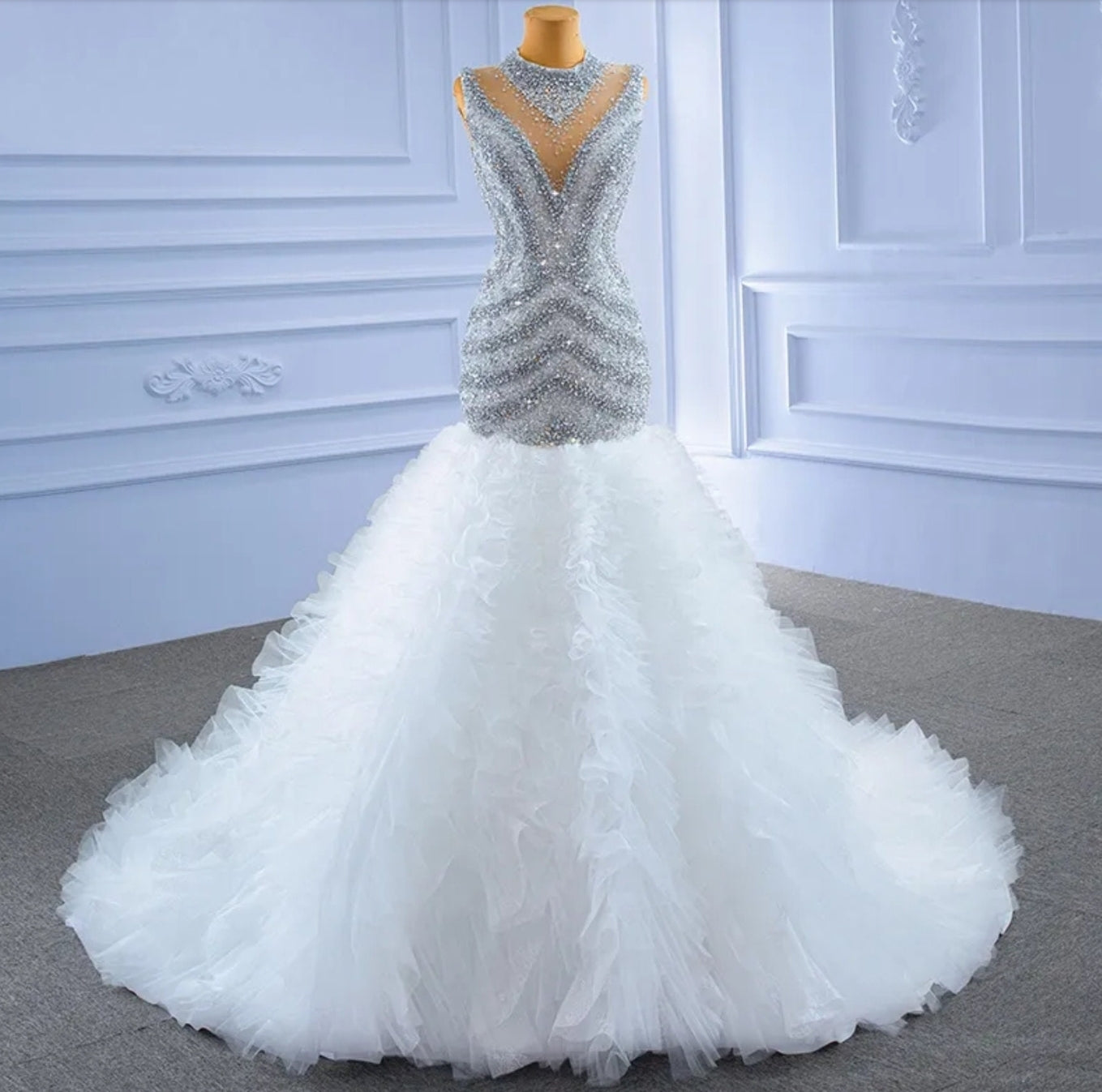 Exquisitely Hand Beaded Sleeveless Illusion High Neck Fit To Flare Layered Ruffle Fishtail Gown