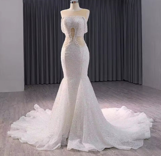Elegant Sleeveless Crystal Beaded Illusion Boat Neck Bridal & Ceremonial Gown With Draped Beading And Cutout Center Detail