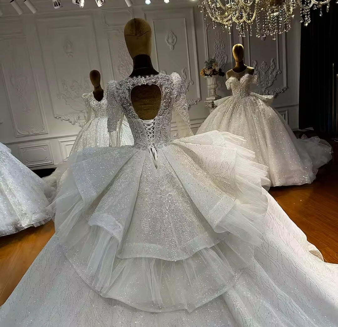 Multi Beaded Long Sleeve Bridal Ball Gown With Layered Puff Back Detail With Open Back And Lace Up