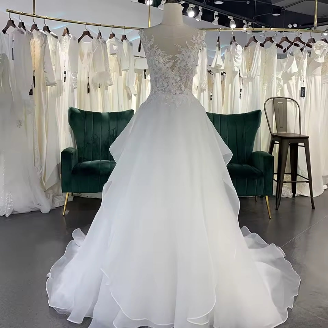 Sleeveless Floral Illusion V Neck Layered Flowing Elegant A-Line Bridal And Ceremonial Gown