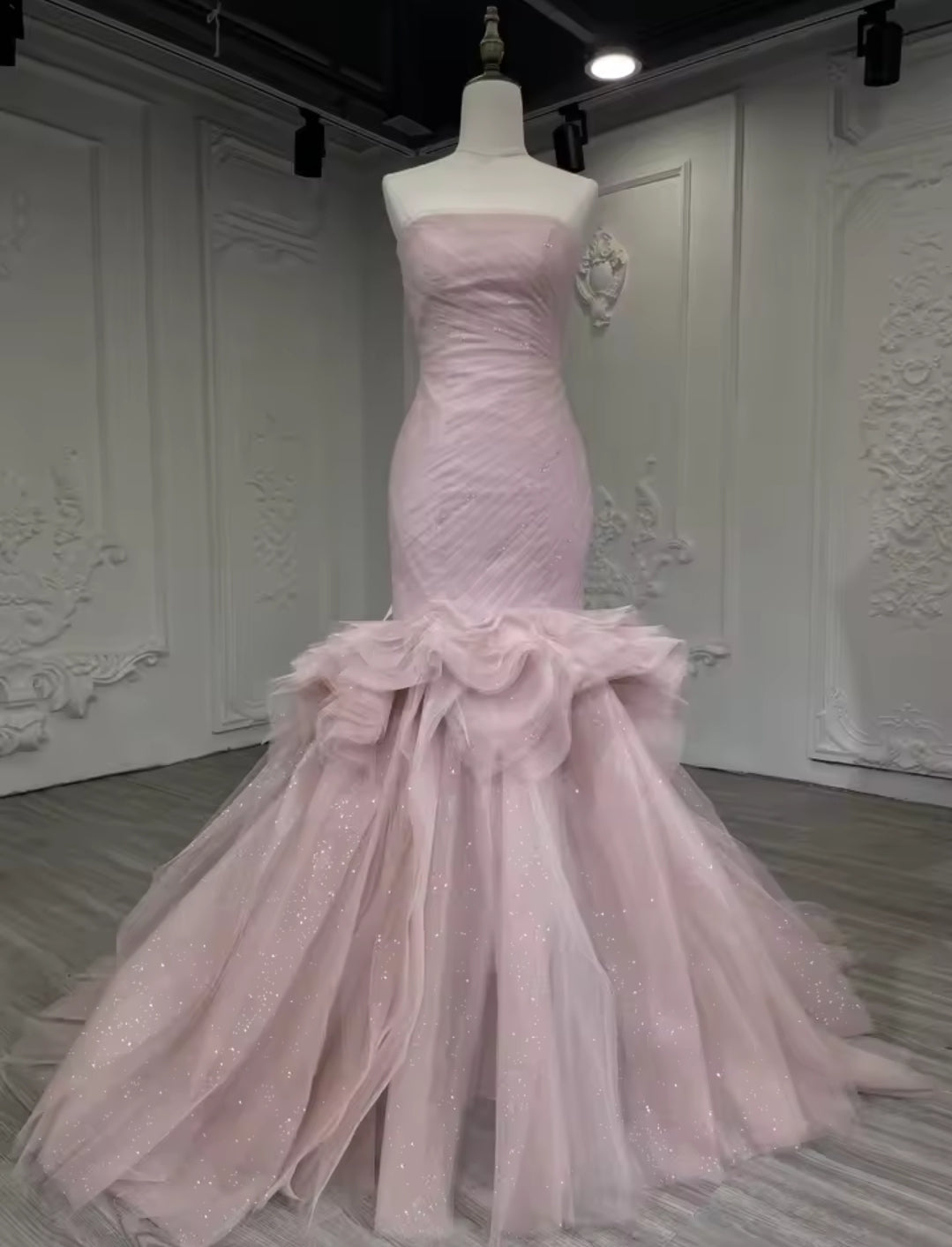 Strapless Boat Neck Scattered Beaded Detail With Pleated Criss Cross Design And Layered Skirt Fit To Flare Gown