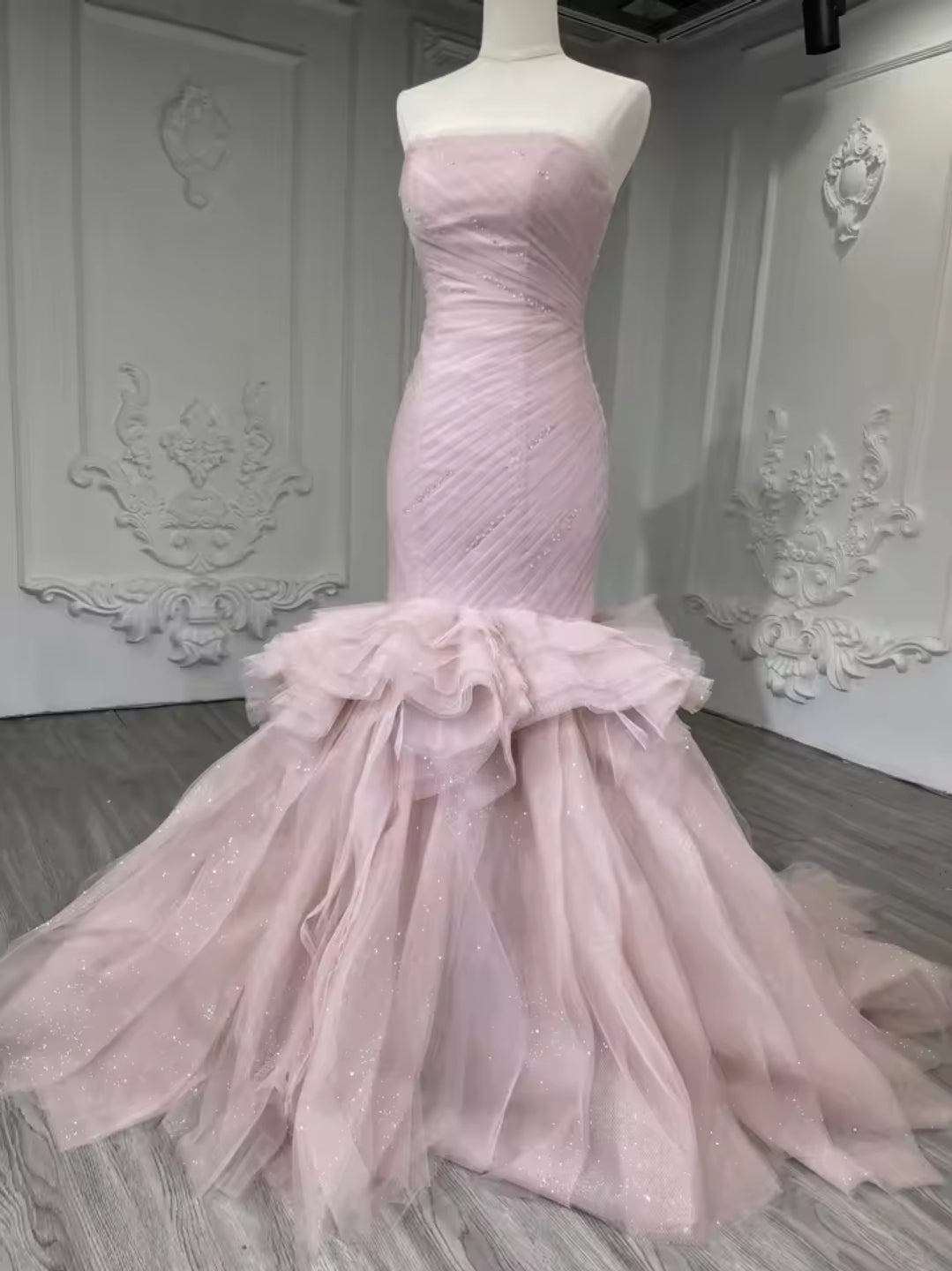 Strapless Boat Neck Scattered Beaded Detail With Pleated Criss Cross Design And Layered Skirt Fit To Flare Gown