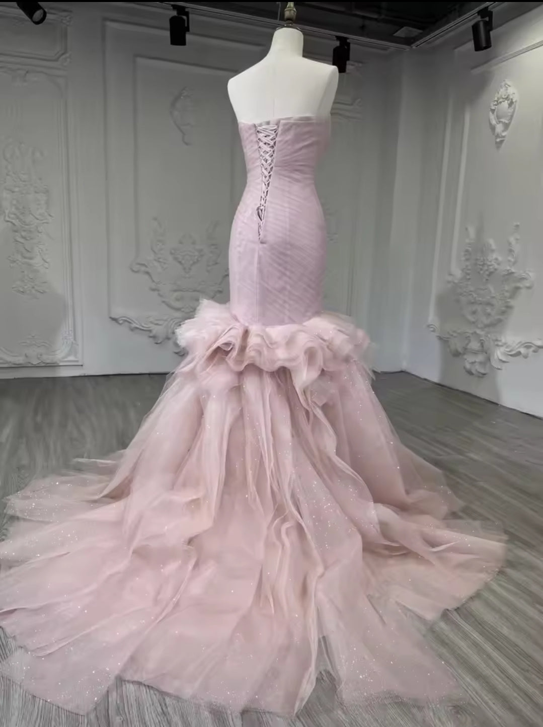 Strapless Boat Neck Scattered Beaded Detail With Pleated Criss Cross Design And Layered Skirt Fit To Flare Gown