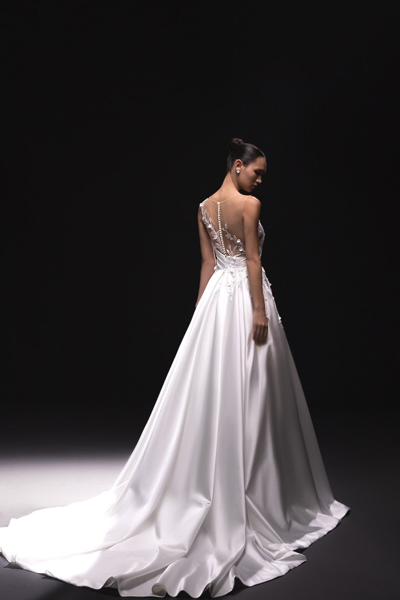 Sleeveless Asymmetrical Illusion Floral Beaded Appliqué A-Line Bridal Gown