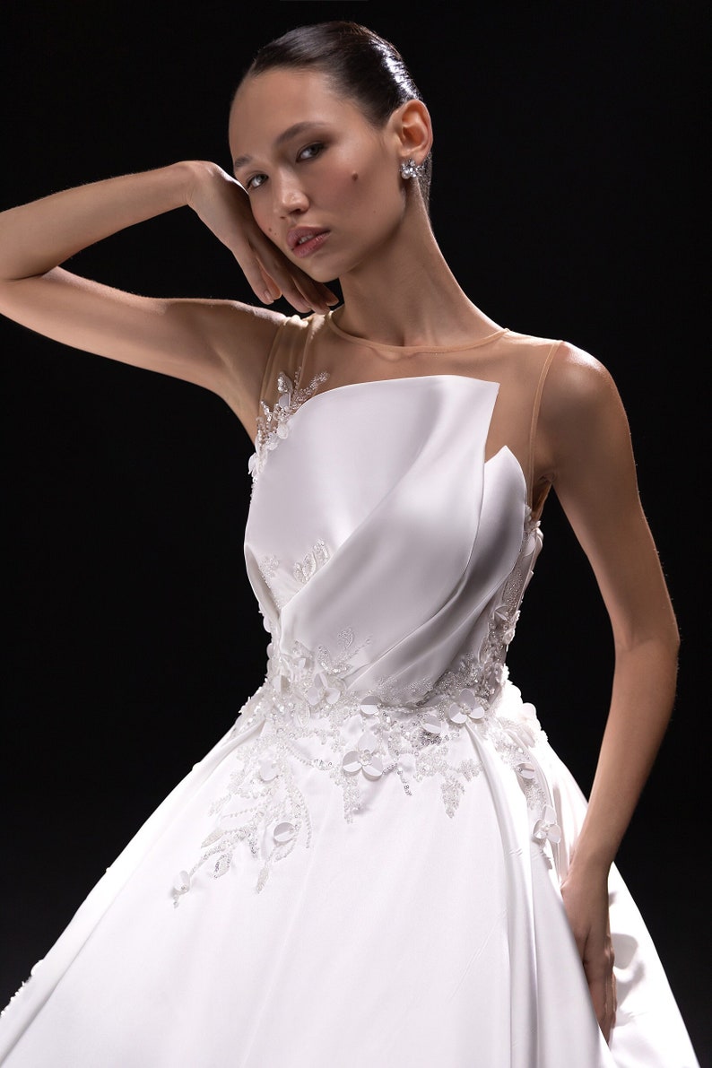 Sleeveless Asymmetrical Illusion Floral Beaded Appliqué A-Line Bridal Gown