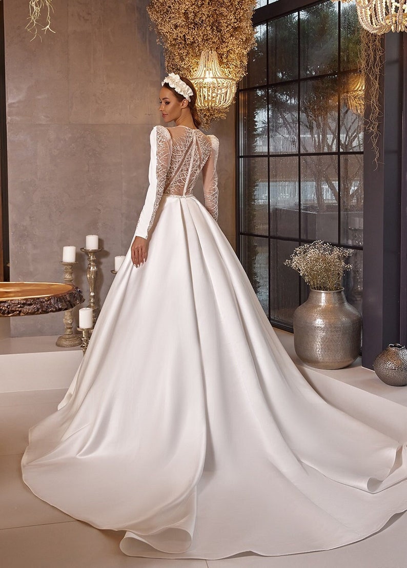 Beautifully Beaded Long Sleeve Modest A-Line Sheek Ceremonial Bridal Gown