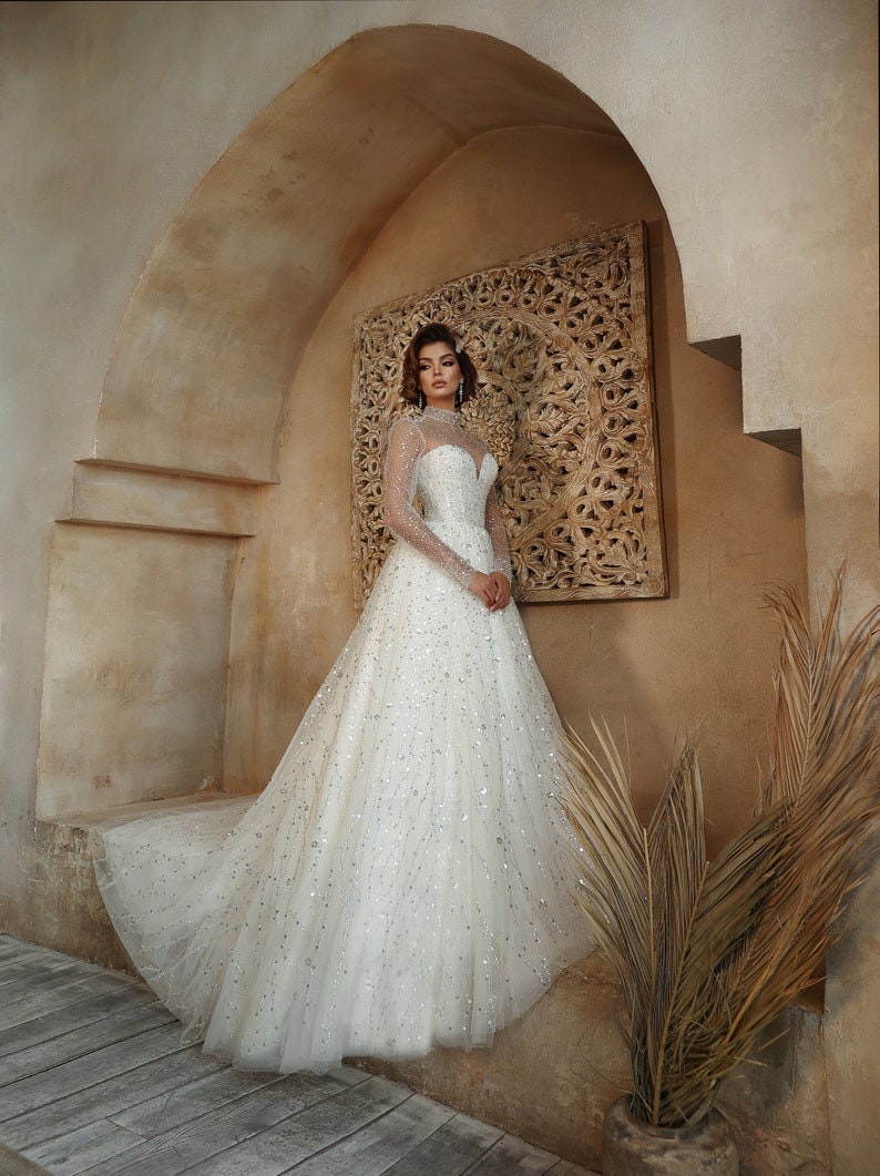 Whimsical Shimmering Sparkling Long Sleeve Mid Neck Sophisticated Sweetheart Bridal Gown