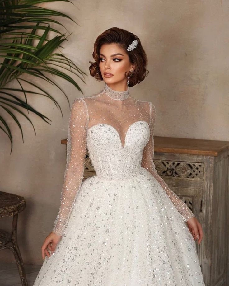 Whimsical Shimmering Sparkling Long Sleeve Mid Neck Sophisticated Sweetheart Bridal Gown