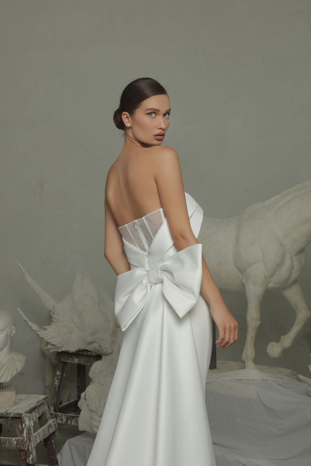 Simply Minimalist Layered Over Strapless Boat Neck Bodice Sheath Gown With Trailing Bow Knot Mermaid Train