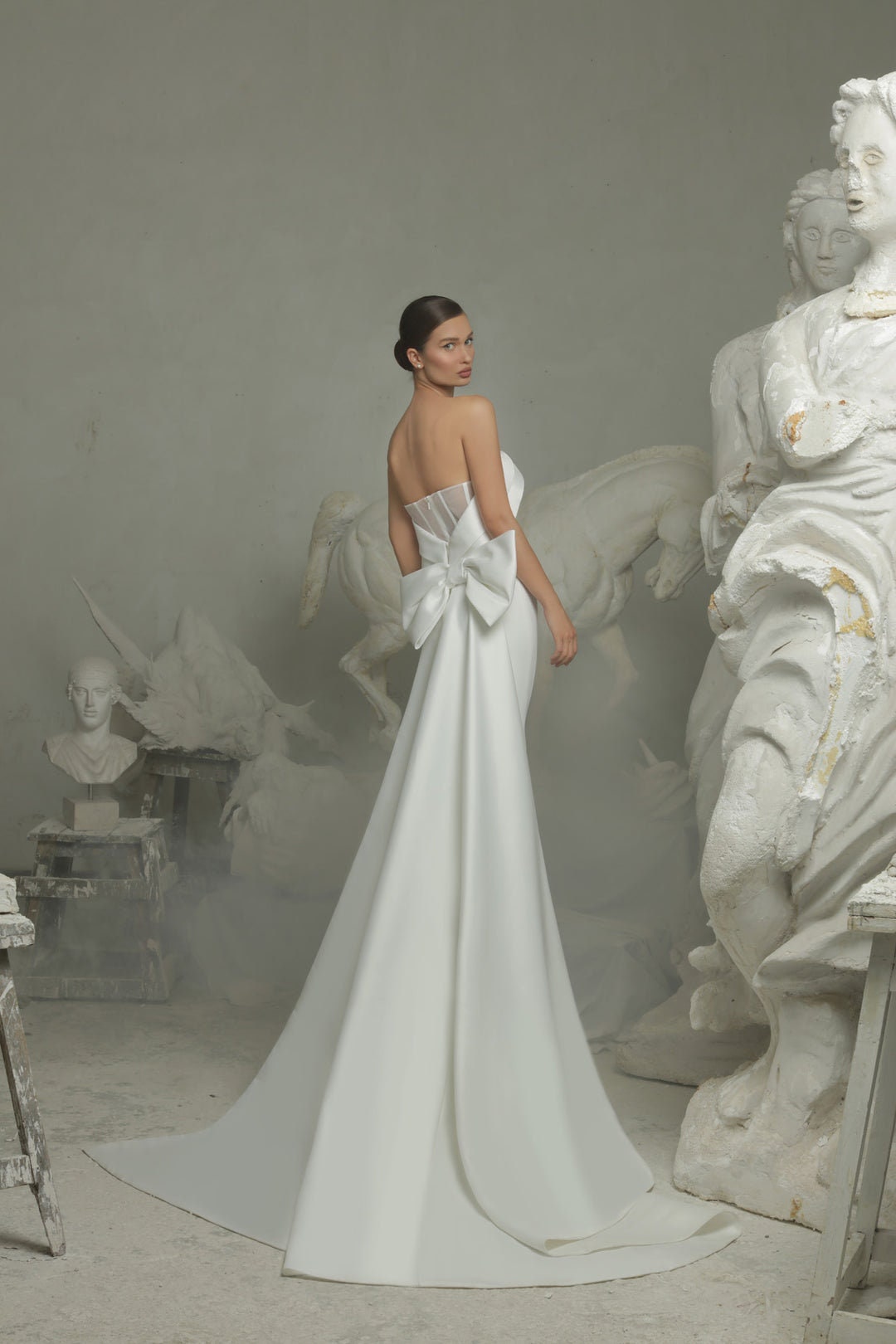 Simply Minimalist Layered Over Strapless Boat Neck Bodice Sheath Gown With Trailing Bow Knot Mermaid Train