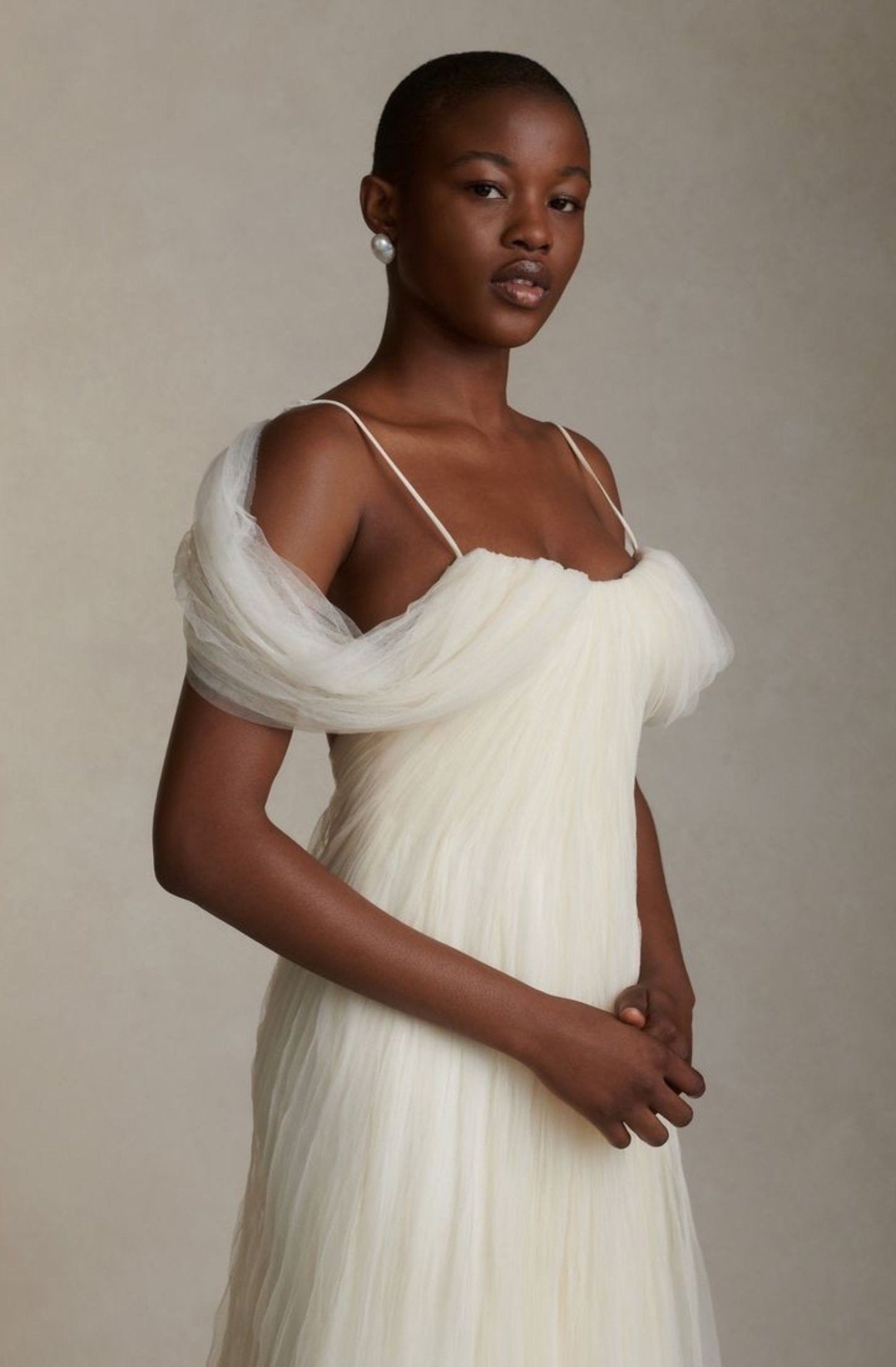 Soft Pleated Tulle Draped Off The Shoulder With Spaghetti Strap Floor Length Open Back Gown With Low Center Zip Enclosure