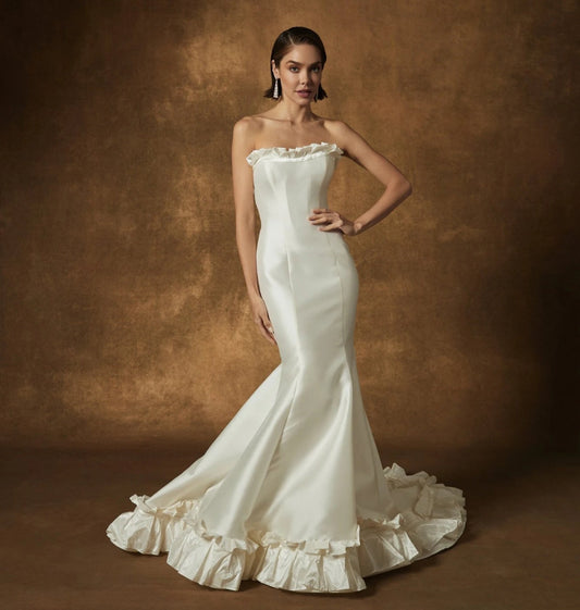 Strapless Mikado Ivory Ruffled Half Scoop Neckline Pleated Minimalist Mermaid Bridal Gown With Ruffled Hem