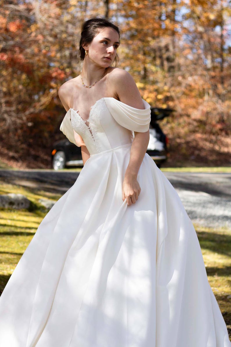 Pleated Off The Shoulder Plunging Sweetheart Floral Appliqué Minimalist A-Line Bridal Gown