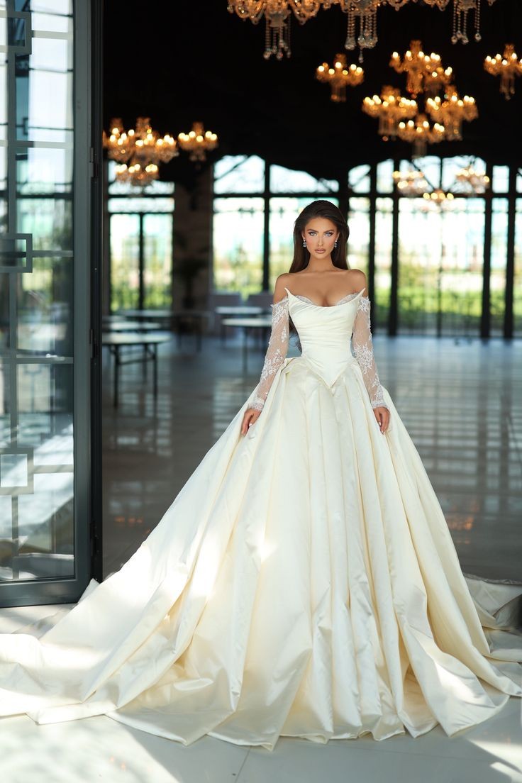 Off The Shoulder Lace Long Sleeve Sculpted Bodice And Pleated Skirt Wedding Gown