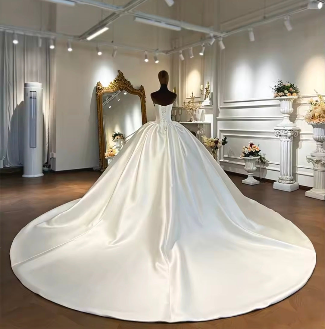Modern And Modest Mikado Satin Strapless Beaded Neckline A-Line Gown With Long Sleeve Beaded Jacket.