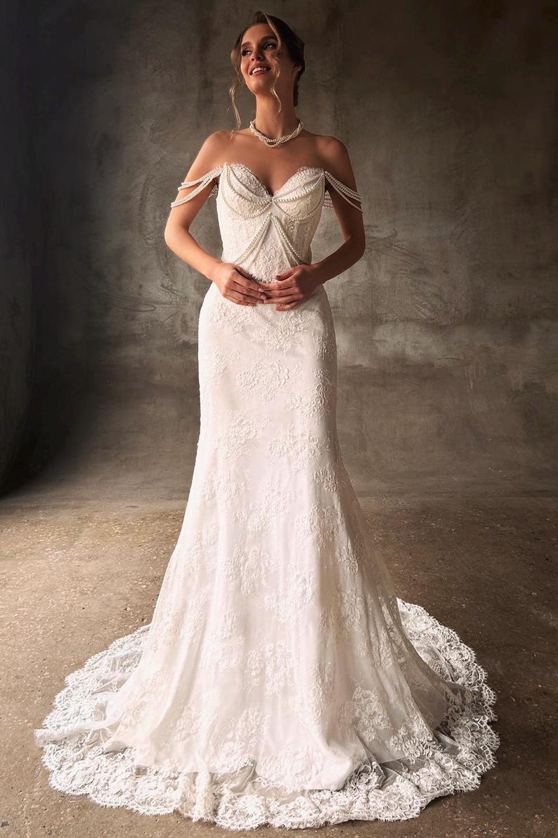Pearl Beaded Spaghetti Strap Off The Shoulder Sweetheart Scattered Floral Lace Trumpet Bridal Gown With Draping Pearl Beading Detail