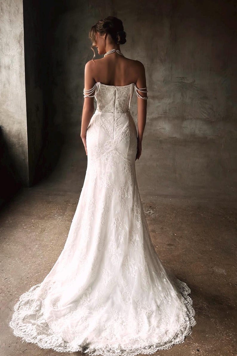 Pearl Beaded Spaghetti Strap Off The Shoulder Sweetheart Scattered Floral Lace Trumpet Bridal Gown With Draping Pearl Beading Detail