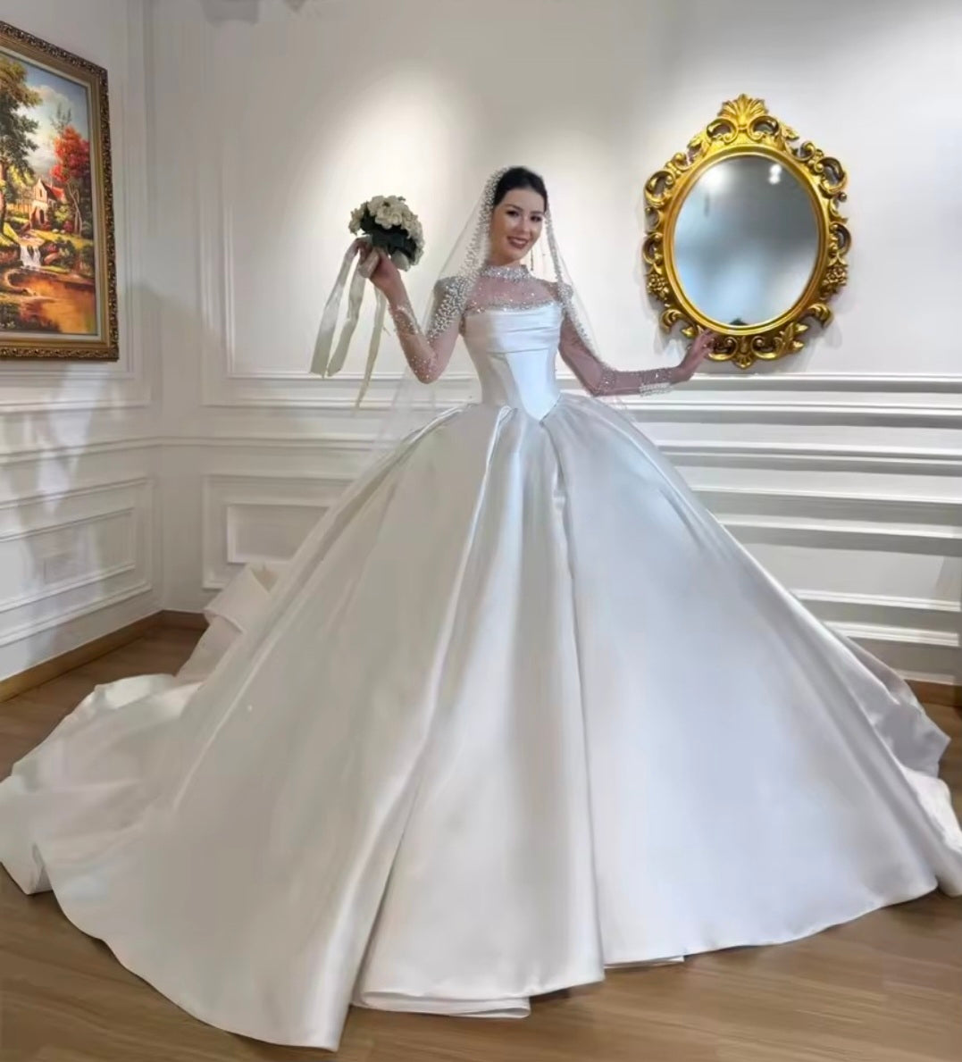 Modern And Modest Mikado Satin Strapless Beaded Neckline A-Line Gown With Long Sleeve Beaded Jacket.