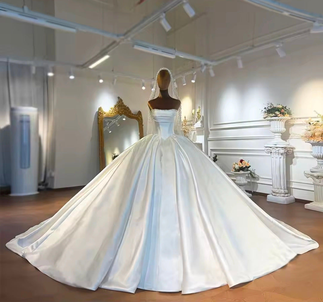 Modern And Modest Mikado Satin Strapless Beaded Neckline A-Line Gown With Long Sleeve Beaded Jacket.