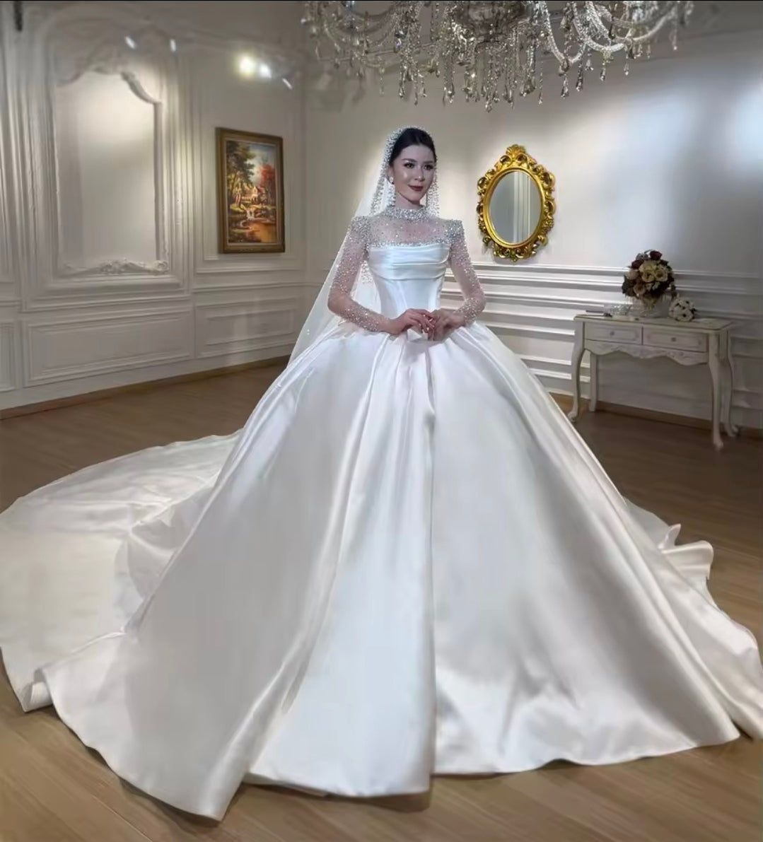 Modern And Modest Mikado Satin Strapless Beaded Neckline A-Line Gown With Long Sleeve Beaded Jacket.